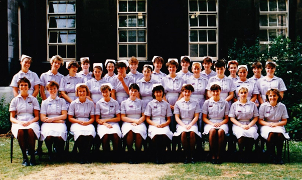 zoe sitting down 4th from left.png